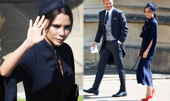 Victoria Beckham arrives for the royal wedding in a figure hugging navy pencil dress
