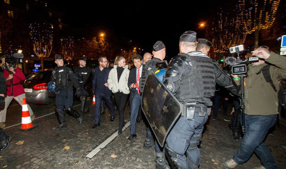 Christmas cancelled: Riot police and protestors clash - smoke bombs erupt on Paris streets