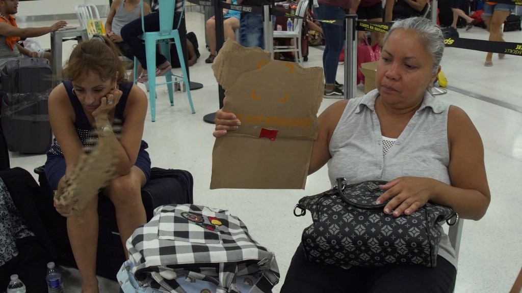 Passengers in Puerto Rican airport have little water or food, no working ATMs and no idea when theyll leave