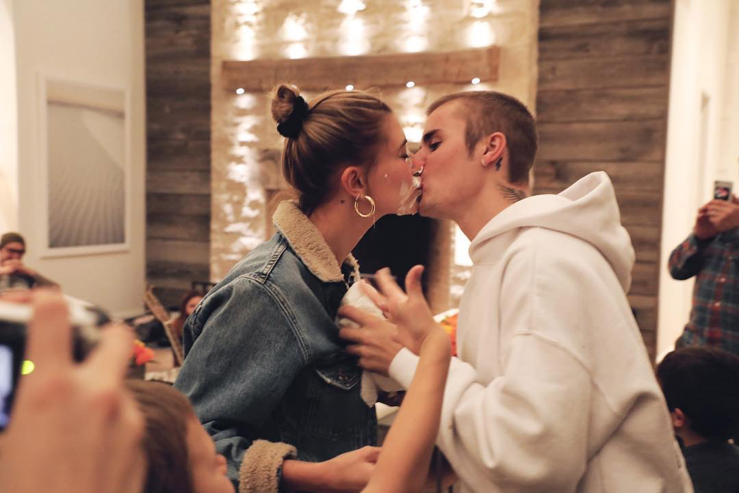 Justin Bieber Sings Happy Birthday to Wife Hailey Baldwin — and Shoves Her Face into Sheet Cake