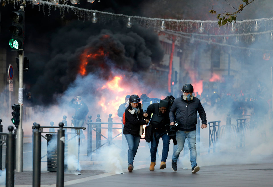 More than 1,300 were arrested and dozens injured after violent anti-government protests engulfed France