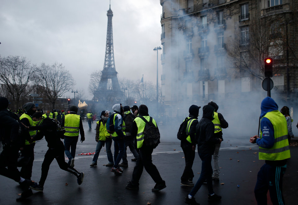 More than 1,300 were arrested and dozens injured after violent anti-government protests engulfed France