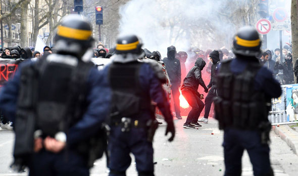 PARIS ERUPTS: Furious scenes on streets of France as THOUSANDS rally against Macron