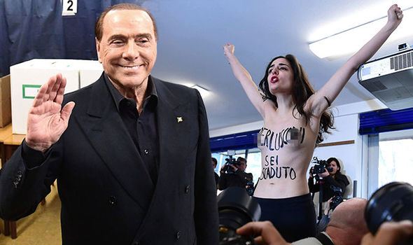 WATCH: Moment topless activist confronts Silvio Berlusconi as he casts vote