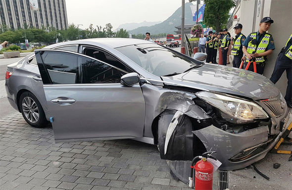 Car RAMS into US Embassy in Seoul driven by North Korean defector screaming help me!