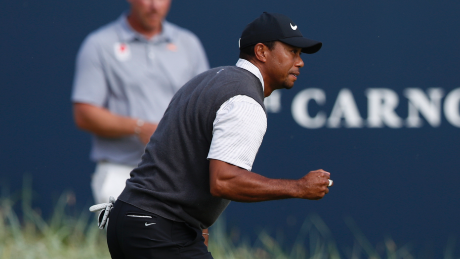 The Latest: Woods shoots 66, in contention at British Open