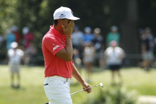 The Latest: Tiger makes turn at PGA just 2 shots off lead
