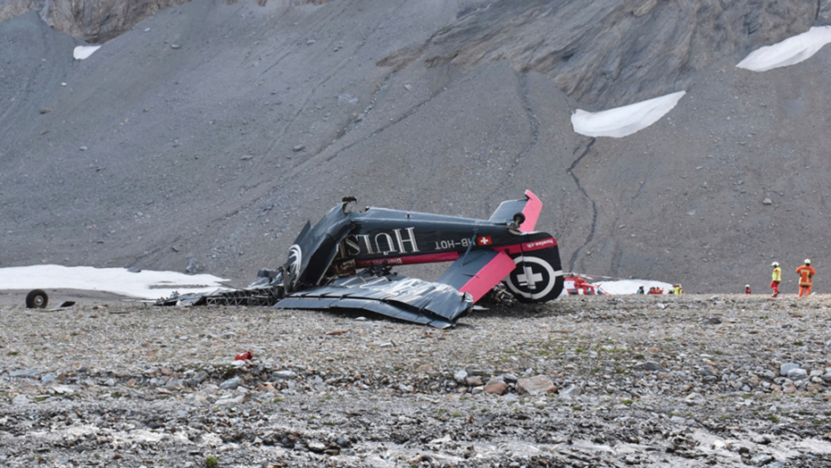 Old-time plane crashes in Swiss Alps, killing 20 on board