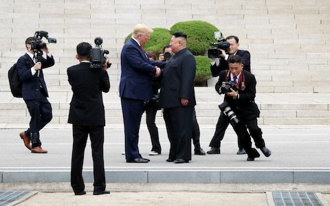 Donald Trump shares handshake with Kim Jong-un at DMZ, becoming first sitting US president to enter North Korea