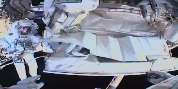 Spacewalking astronauts plug leak, finish fixing detector