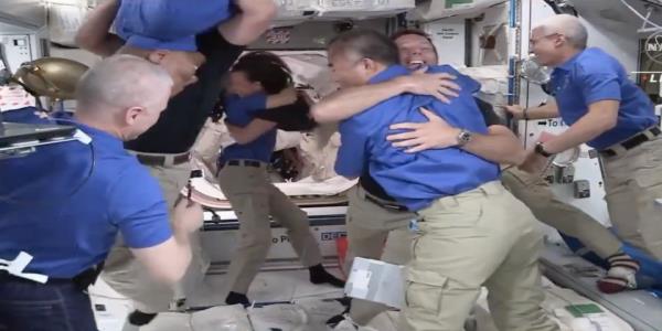 Watch International Space Station astronauts joyously greet new arrivals after successful SpaceX flight