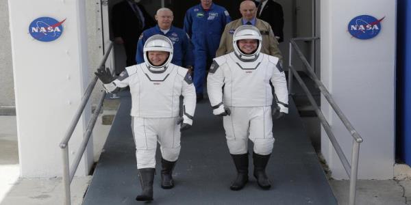 NASA and SpaceXs launch was postponed, but at least we got to see their wildly corny spacesuits